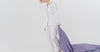 Woman in white silk sleepwear in bright minimalist studio — thoughtful luxury silk gifts for women who have everything Australia Calliope Studio