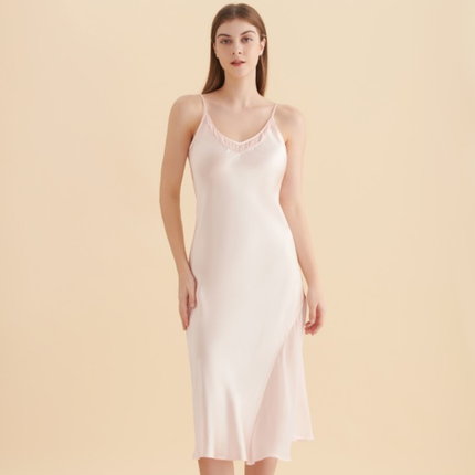 Woman wearing blush pink 22 momme mulberry silk slip nightdress — Calliope Studio Australia